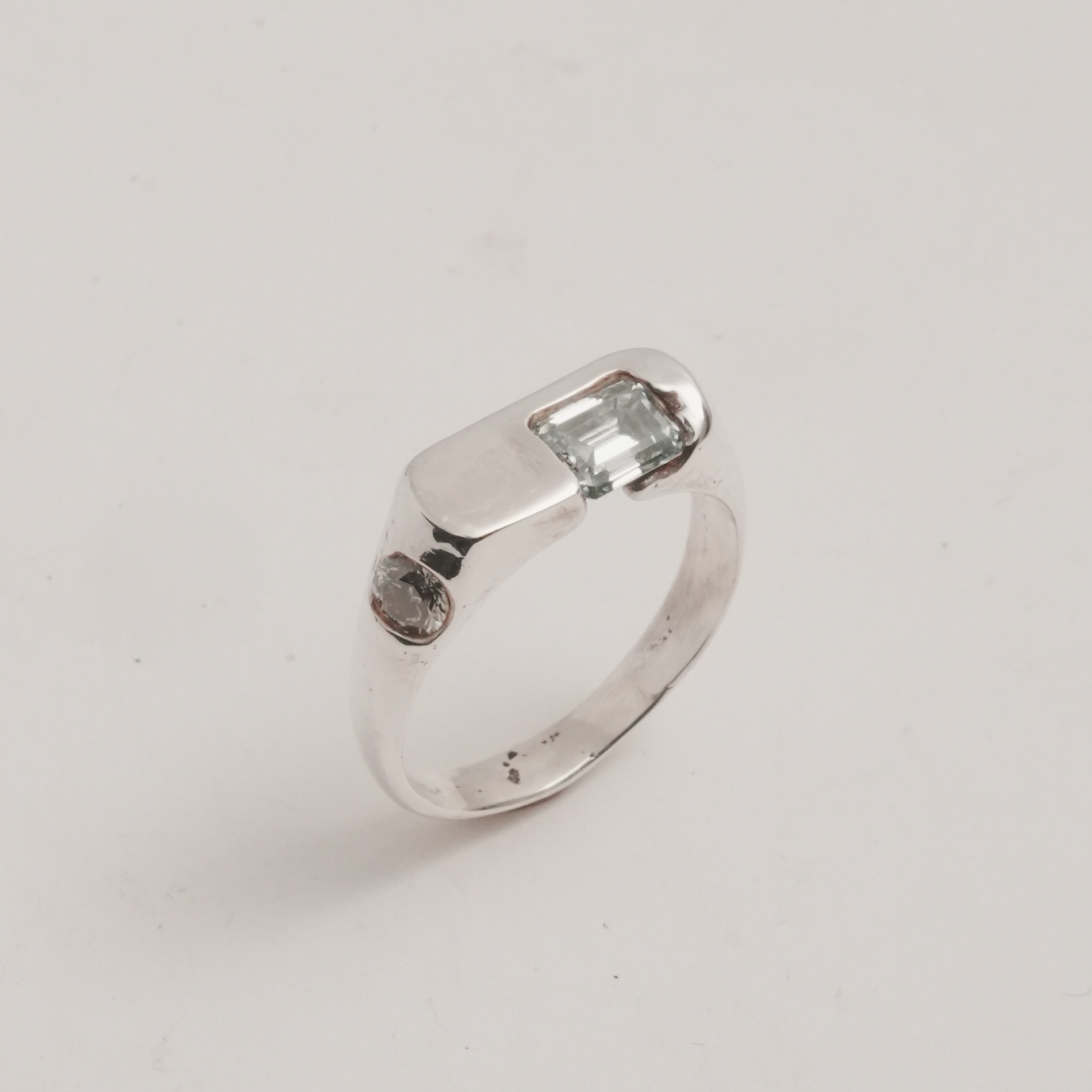 The Exception, sterling band set with an emerald-cut blue moissanite and a lab-grown diamond