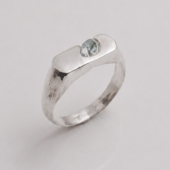 OIAM No. 6, sterling band set with an ice-blue stone