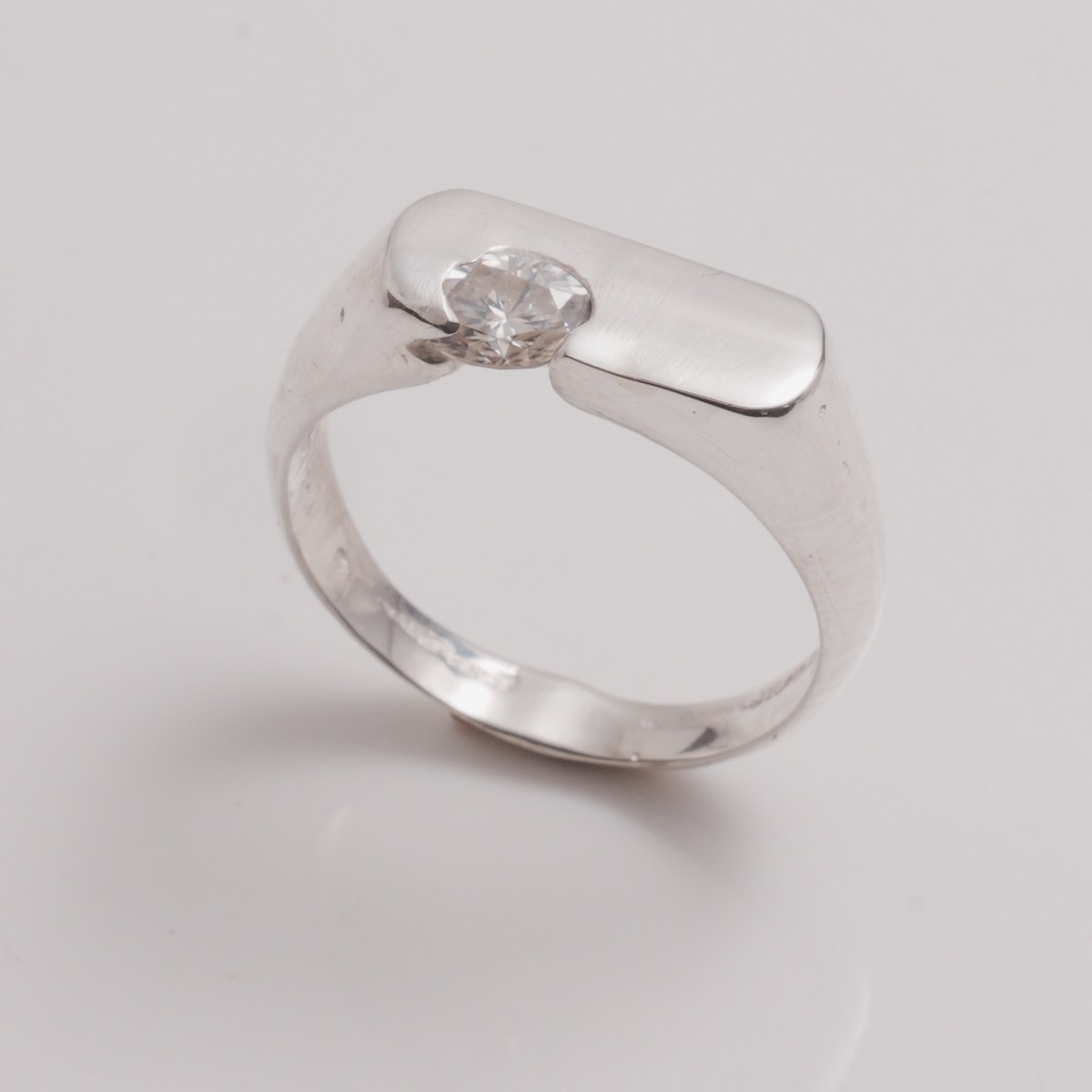 OIAM No. 7, sterling band set with a round white stone